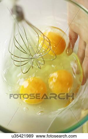 Person whisking eggs View Large Photo Image Stock Photo - Person whisking eggs. Fotosearch