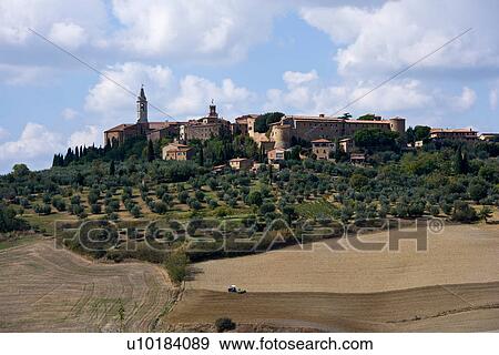 Stock Photo - Ploughed fields and Tuscan town of Pienza, Italy. Fotosearch