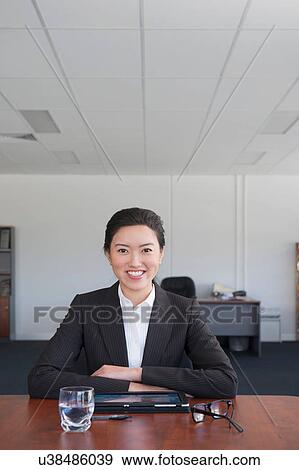 Portrait of businesswoman looking at camera View Large Photo Image Stock Photo - Portrait of businesswoman looking at camera. Fotosearch