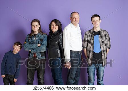 Portrait of family of five in front of purple background View Large Photo Image Stock Photograph - Portrait of family of five in front of purple background. Fotosearch