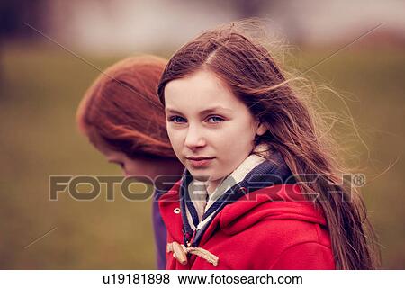 Portrait of girl walking with friend outdoors View Large Photo Image Stock Photo - Portrait of girl walking with friend outdoors. Fotosearch