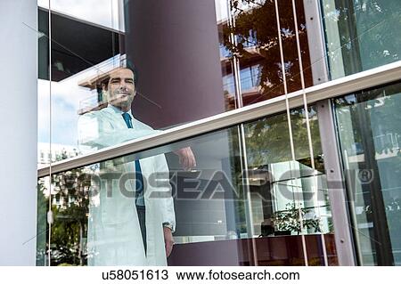 Stock Image - Portrait of male doctor inside hospital. Fotosearch