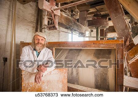 Portrait of man in windmill View Large Photo Image Stock Image - Portrait of man in windmill. Fotosearch
