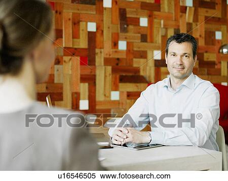 Stock Photography - Portrait of mature man in meeting. Fotosearch