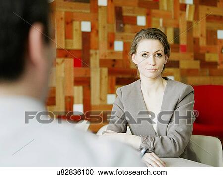 Portrait of mid adult businesswoman in meeting View Large Photo Image Stock Image - Portrait of mid adult businesswoman in meeting. Fotosearch
