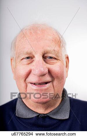 Portrait of senior man smiling, studio shot View Large Photo Image Picture - Portrait of senior man smiling, studio shot. Fotosearch