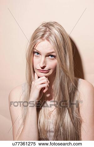 Stock Photography - Portrait of unimpressed young blonde woman. Fotosearch