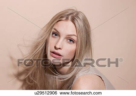 Stock Photograph - Portrait of young blonde woman, close up. Fotosearch