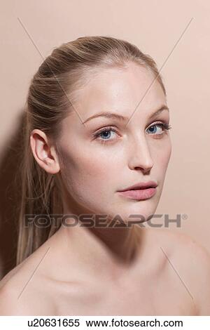 Stock Photography - Portrait of young blonde woman, close up. Fotosearch