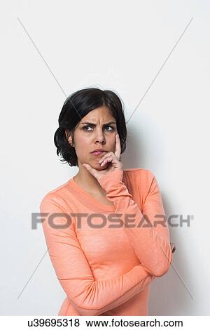 Stock Photo - Portrait of young female grimacing. Fotosearch