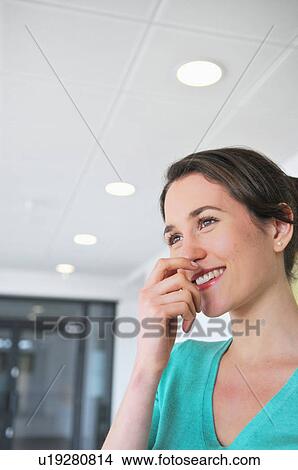 Picture - Portrait of young female office worker. Fotosearch