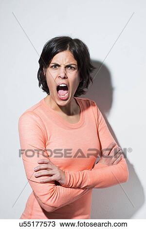 Portrait of young female shouting View Large Photo Image Stock Image - Portrait of young female shouting. Fotosearch