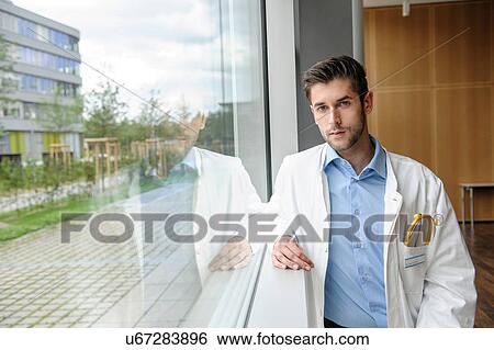 Stock Photograph - Portrait of young male doctor. Fotosearch