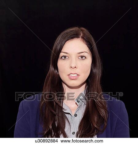 Portrait of young woman against black background View Large Photo Image Picture - Portrait of young woman against black background. Fotosearch