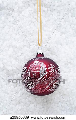 Stock Photo - Red bauble with illustration of house. Fotosearch