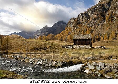 Remote shack by stream in Alp Devero, Alpi, Piedmont, Italy View Large Photo Image Stock Image - Remote shack by stream in Alp Devero, Alpi, Piedmont, Italy. Fotosearch