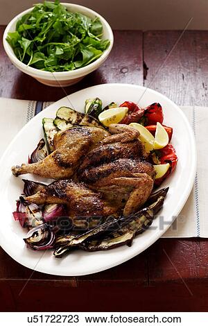 Stock Image - Roast chicken and vegetables on plate. Fotosearch