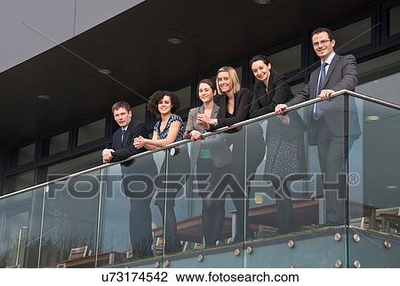 Six office colleagues on balcony View Large Photo Image Stock Image - Six office colleagues on balcony. Fotosearch