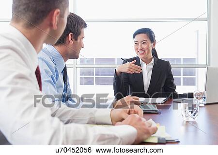 Three business colleagues in office meeting View Large Photo Image Stock Photograph - Three business colleagues in office meeting. Fotosearch