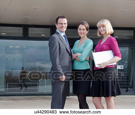 Three office colleagues outside building View Large Photo Image Stock Image - Three office colleagues outside building. Fotosearch