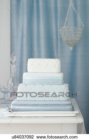 Three tiered wedding cake with blue decorations View Large Photo Image Stock Image - Three tiered wedding cake with blue decorations. Fotosearch