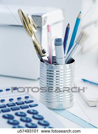 Stock Image - Tincan containing stationery items. Fotosearch