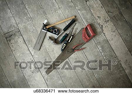 Tools on wooden floorboards of new home View Large Photo Image Stock Image - Tools on wooden floorboards of new home. Fotosearch