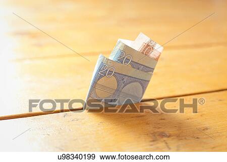 Twenty Euro note in between floorboards View Large Photo Image Stock Photo - Twenty Euro note in between floorboards. Fotosearch