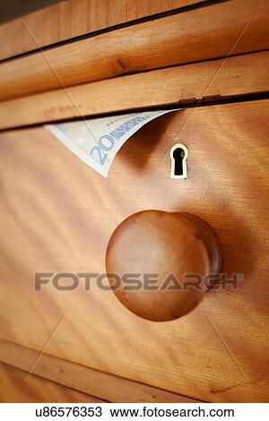 Stock Image - Twenty Euro note in drawer, close up. Fotosearch