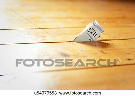 Twenty pound note in between floorboards View Large Photo Image Stock Image - Twenty pound note in between floorboards. Fotosearch