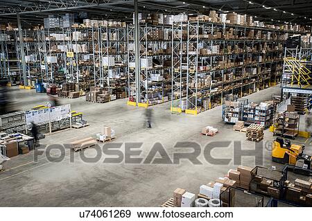 Vast distribution warehouse interior, elevated view View Large Photo Image Stock Photo - Vast distribution warehouse interior, elevated view. Fotosearch