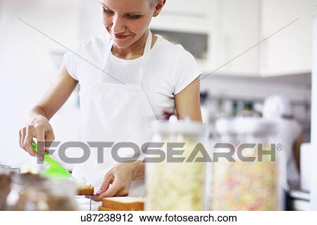 Woman decorating cake View Large Photo Image Stock Image - Woman decorating cake. Fotosearch