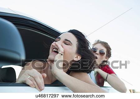 Woman shouting through car window View Large Photo Image Stock Photo - Woman shouting through car window. Fotosearch