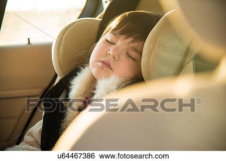 Young girl sleeping in car View Large Photo Image Stock Photograph - Young girl sleeping in car. Fotosearch