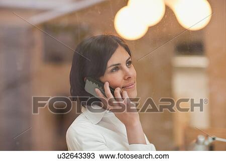 Young woman using smartphone View Large Photo Image Stock Image - Young woman using smartphone. Fotosearch