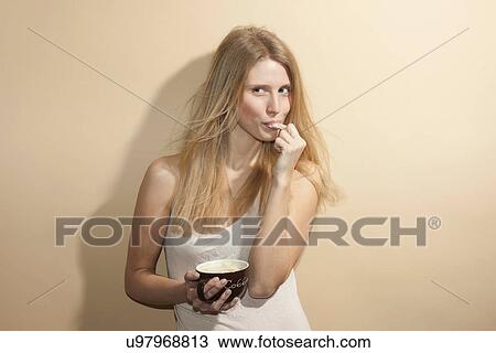 Young Woman With Long Blonde Hair Tasting Coffee Stock Image U97968813 Fotosearch