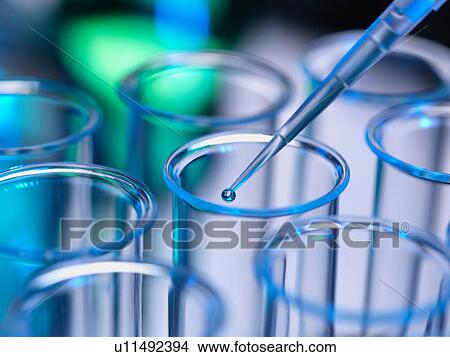 Picture - Analytical chemistry - sample being pipetted into test tube for analysis in laboratory. Fotosearch