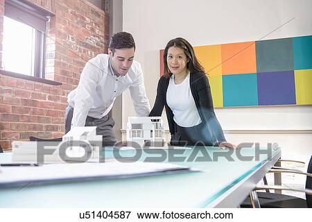 Architect working with colleague in office, portrait View Large Photo Image Stock Photo - Architect working with colleague in office, portrait. Fotosearch