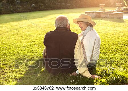 Back view of husband and wife spending time together View Large Photo Image Stock Image - Back view of husband and wife spending time together. Fotosearch