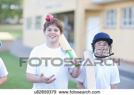 Stock Photo - Boy catching cricket ball. Fotosearch