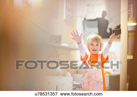 Boy cleaning up after painting View Large Photo Image Stock Photo - Boy cleaning up after painting. Fotosearch