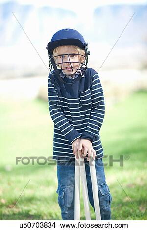 Boy in cricket helmet View Large Photo Image Picture - Boy in cricket helmet. Fotosearch
