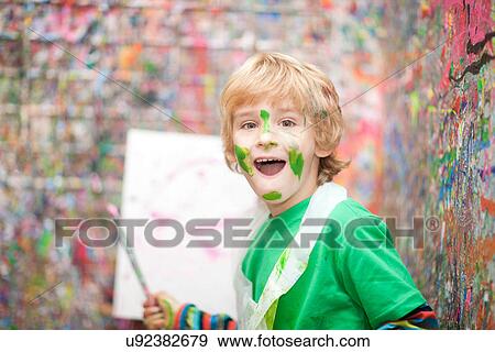 Boy in paint splattered room View Large Photo Image Stock Photo - Boy in paint splattered room. Fotosearch