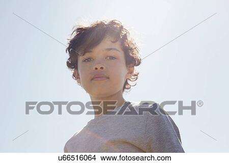 Boy looking down at camera View Large Photo Image Picture - Boy looking down at camera. Fotosearch
