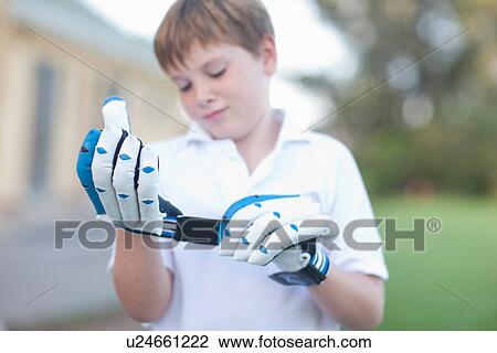 Boy putting on cricket gloves View Large Photo Image Stock Image - Boy putting on cricket gloves. Fotosearch