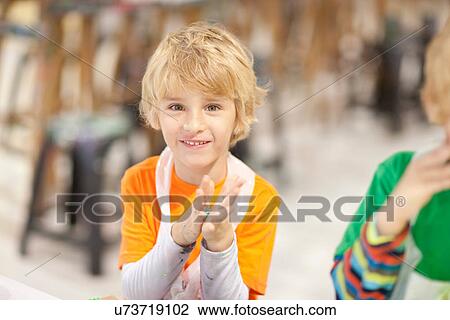 Boy using modelling clay View Large Photo Image Stock Image - Boy using modelling clay. Fotosearch