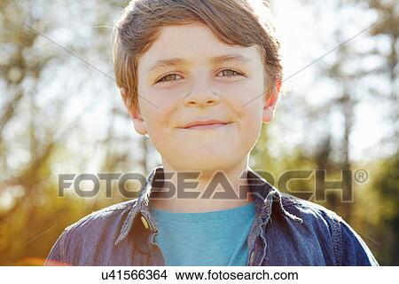 Picture - Boy with cheeky grin. Fotosearch