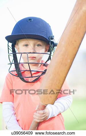 Stock Photo - Boy with cricket bat. Fotosearch