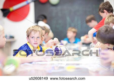Boys making craft objects View Large Photo Image Stock Photo - Boys making craft objects. Fotosearch