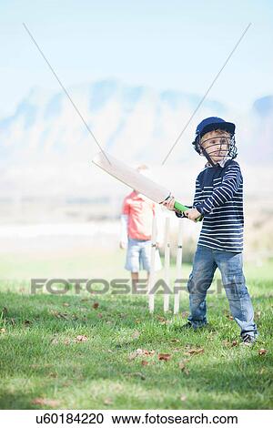 Boys playing cricket View Large Photo Image Stock Image - Boys playing cricket. Fotosearch